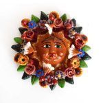 Polychrome clay sun